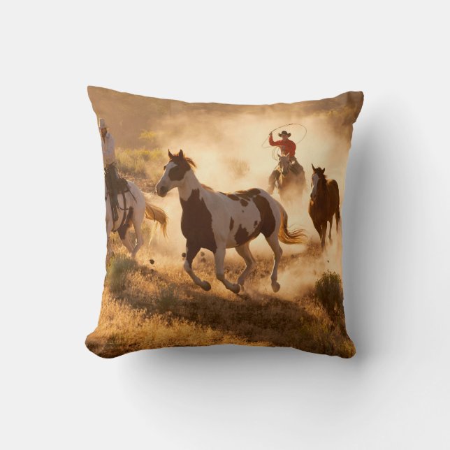 Two western cowboys riding horses, roping wild hor throw pillow (Front)