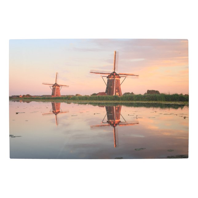 Two windmills with reflection at sunset metal print (Front)