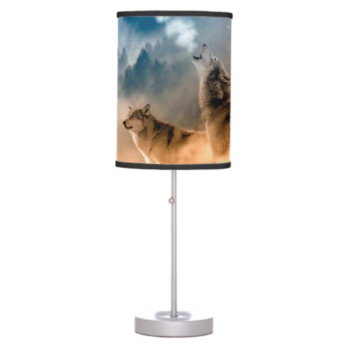 Two wolves howl at the full moon in forest table lamp