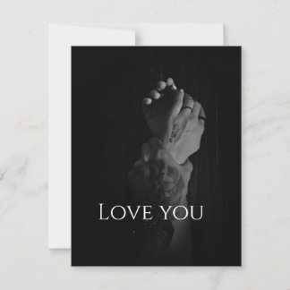 Two Women's Hands Held by a Man's Note Card