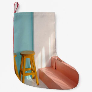 Two yellow wooden bar stools small christmas stocking