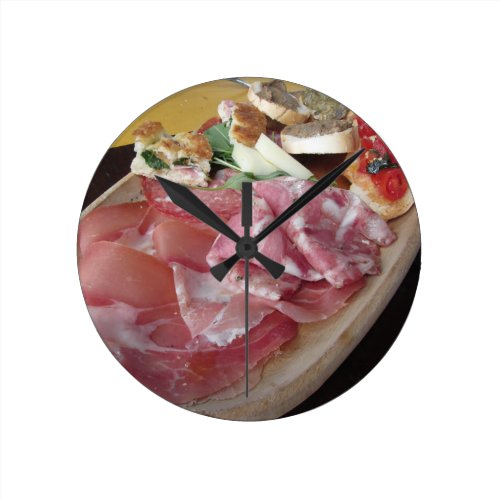 Typical rustic tuscan appetizer . Italian starter Round Clock