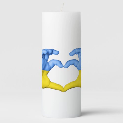 Ukraine hands show symbol of heart pillar candle