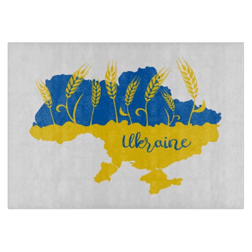 Ukraine typography and wheat ear on Ukrainian flag Cutting Board