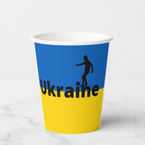 Ukrainian soccer player using dot as a ball    paper cups