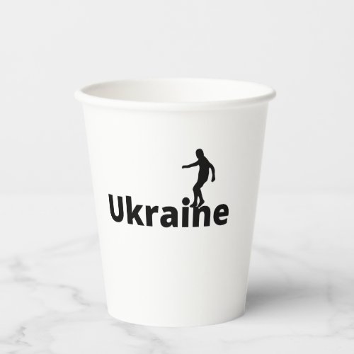 Ukrainian soccer player using dot as a ball paper cups