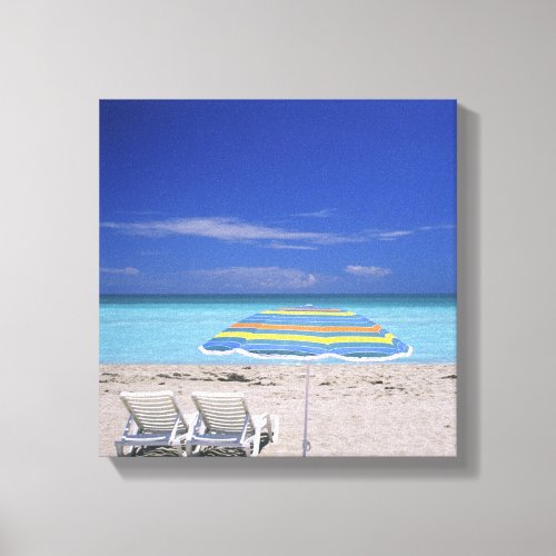 Umbrella and two lounge chairs on beach Miami Canvas Print