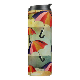 UMBRELLA PATTERNS IN A CAPTIVATING COLLAGE THERMAL TUMBLER