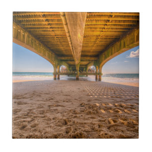 Under a Pier, Beach, Sand, Footprints, Ocean, Sky Tile
