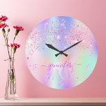 Unicorn glitter pink purple monogram name large clock<br><div class="desc">A trendy rainbow colored background with unicorn and rainbow pastel colors in pink, purple, rose gold, mint green. Decorated with faux glitter dust in pink and purple. Decorated with a rainbow colored unicorn. Personalize and add a name, written with a modern hand lettered style script with swashes. Purple colored letters....</div>