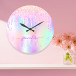 Unicorn glitter pink purple name girl large clock<br><div class="desc">A trendy rainbow colored background with unicorn and rainbow pastel colors in pink, purple, rose gold, mint green. Decorated with faux glitter drips in rose gold, pink and purple. Decorated with a rainbow colored unicorn. Personalize and add a name, written with a modern hand lettered style script with swashes. Purple...</div>