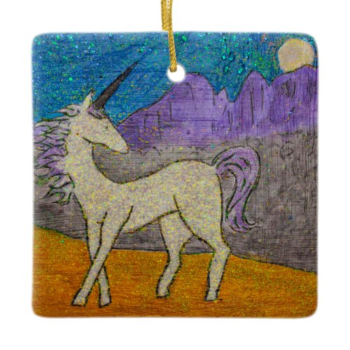 Unicorn looking back at the mountain ridgeline ceramic ornament