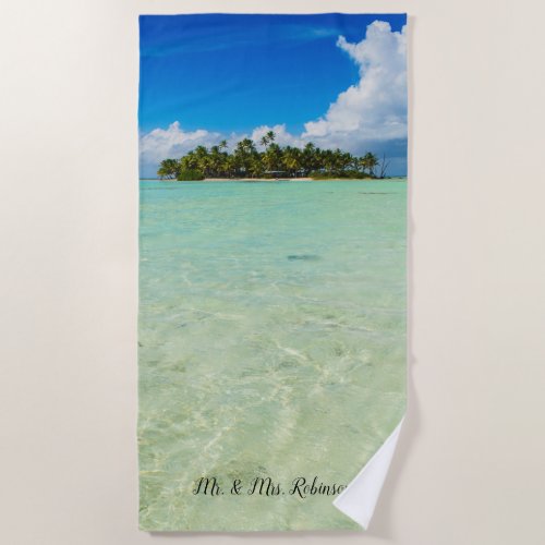 Uninhabited island in a tropical blue lagoon beach towel