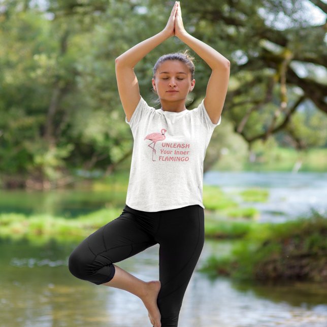 Unleash Your Inner Flamingo T-Shirt (young adult female model wearing unleash your inner flamingo shirt while doing yoga pose)