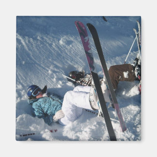 Upside down skiing magnet