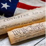 US Founding Documents Cutout<br><div class="desc">Copies of the Declaration of Independence and US Constitution in rolled up scrolls with a vintage American flag</div>