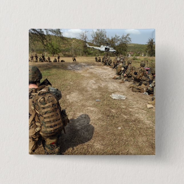 US Marines provide security as a UH-1N Button (Front)