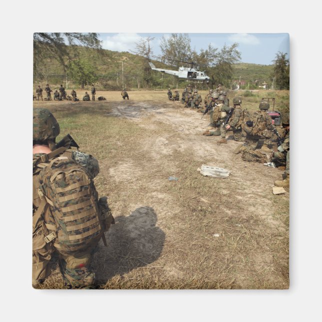 US Marines provide security as a UH-1N Magnet (Front)