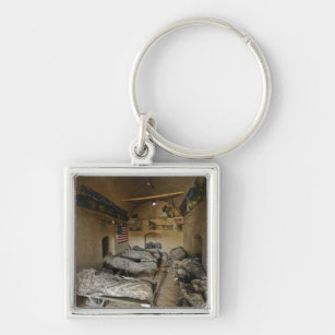 US Soldiers sleep in an abandoned mud house Keychain