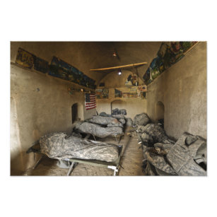 US Soldiers sleep in an abandoned mud house Photo Print