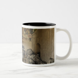 US Soldiers sleep in an abandoned mud house Two-Tone Coffee Mug