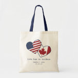 USA and Canada Heart Flags Wedding Tote Bag<br><div class="desc">Love has no borders! Our super cute flag tote features the sweet sentiment in navy blue typewriter style lettering, with the USA and Canada flags inside hand-drawn style hearts. Add your names and wedding date for a sweet favor or welcome bag! Want this item with different flags? Contact me via...</div>