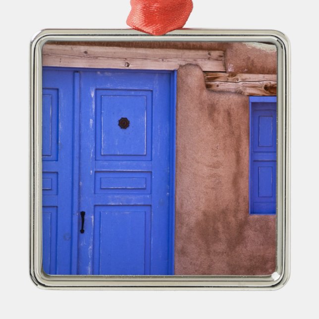 USA, New Mexico, Santa Fe. View of blue door and Metal Ornament (Front)