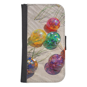 USA, Oregon. Colorful Glass Floats On Sand Dune Phone Wallet