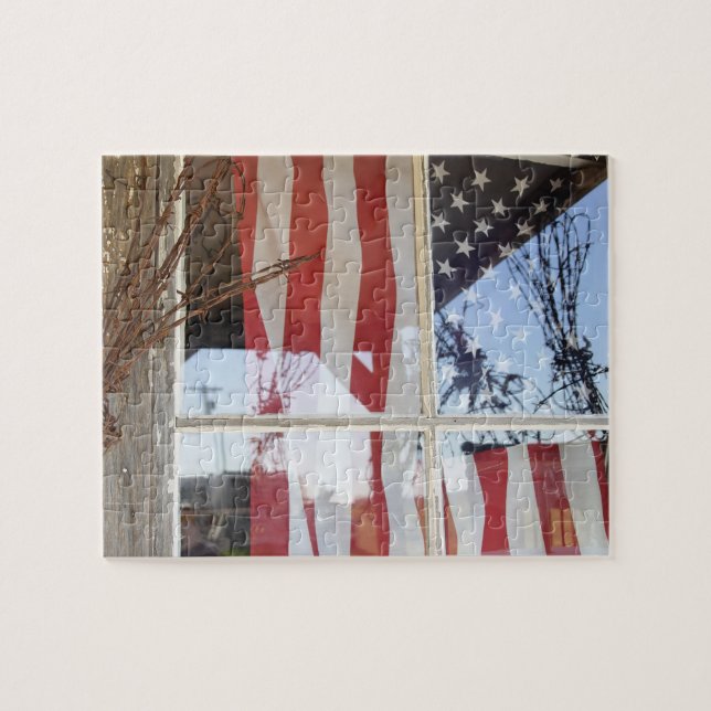 USA, Oregon, Shaniko. Flag in window next to Jigsaw Puzzle (Horizontal)