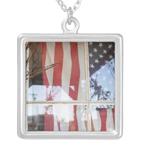 USA Oregon Shaniko Flag in window next to Silver Plated Necklace