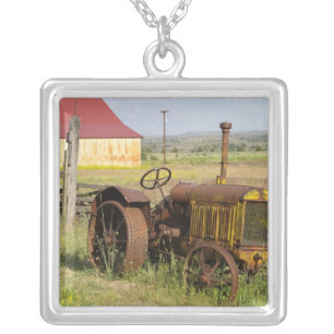 USA, Oregon, Shaniko. Rusty vintage tractor in Silver Plated Necklace