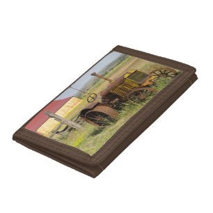 USA, Oregon, Shaniko. Rusty vintage tractor in Tri-fold Wallet