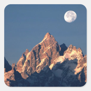 USA, Wyoming, Grand Teton NP. A full moon sets Square Sticker