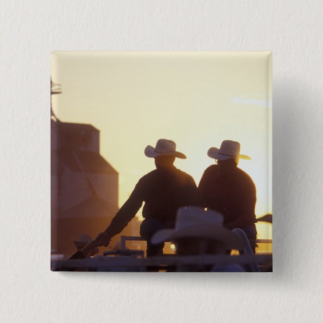 USA, Wyoming, Pine Bluffs. Two men shake Button (Front)