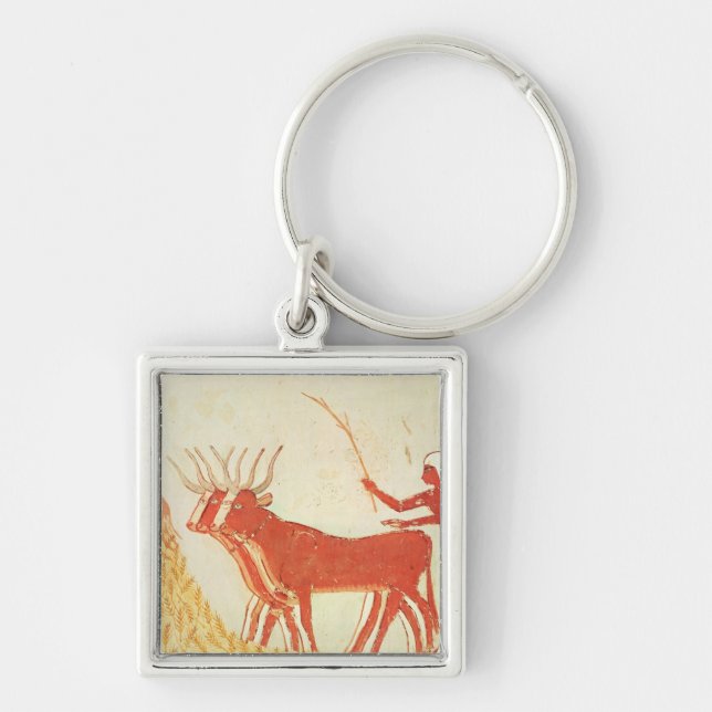 Using cows to trample wheat keychain (Front)