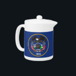 Utah State Flag Teapot<br><div class="desc">Elevate your tea time with a touch of Utah pride using our teapot featuring the flag of Utah! Crafted with meticulous attention to detail, this teapot is more than just a functional item; it’s a celebration of Utah’s heritage. The design prominently displays the iconic Utah state flag, making this teapot...</div>