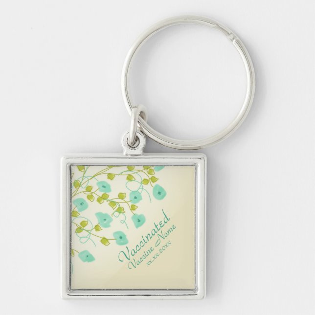 Vaccinated notification with teal flowered keychain (Front)