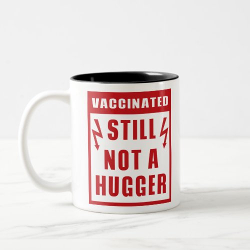 Vaccinated Still Not A Hugger Shock Warning Sign Two_Tone Coffee Mug