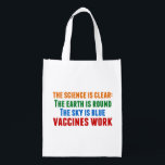 Vaccines Work Pro Vaccination Science Quote Grocery Bag<br><div class="desc">Hillary Clinton quote on vaccination:  the science is clear: the earth is round,  the sky is blue,  vaccines work. Colorful reusable grocery bag to bring awareness to the measles outbreaks and the Covid pandemic. Please vaccinate your children to prevent the spread of diseases and illness.</div>