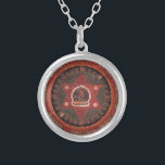 Vajrayogini pendant<br><div class="desc">Painted 19th century Tibetan mandala of the Naropa tradition, Vajrayogini stands in the center of two crossed red triangles</div>