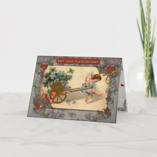 Valentine's - Cupid carries the cart with flowers. Holiday Card