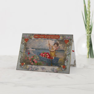 Valentine's - Cupid sails on a boat full of hearts Holiday Card