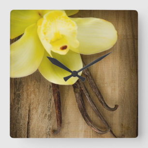 Vanilla Pods and Flower over Wooden Background Square Wall Clock