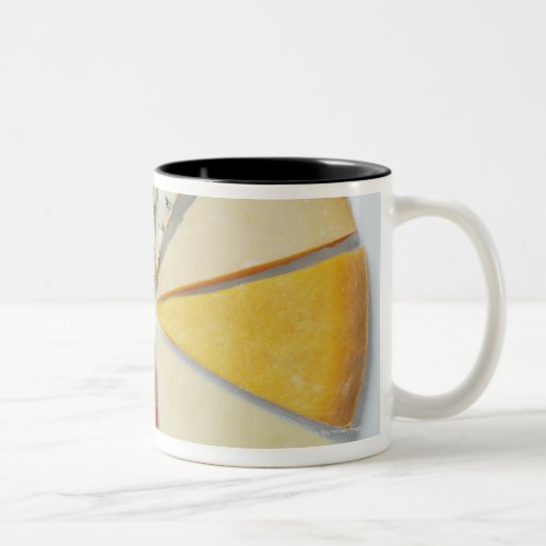 Various pieces of cheese resembling a pie chat Two_Tone coffee mug