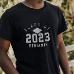 Varsity Style Graduate Class of 2022 Custom Name T-Shirt<br><div class="desc">Fun varsity-style grad t-shirt featuring the graduation year in large numbers with the "class of" displayed in an arch design above. A grad cap and tassel are placed in the center and personalized with the grad's name. Makes a great personalized keepsake gift for the grad.</div>