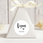 Vegan Item | Modern Casual Script and Heart Favor Classic Round Sticker<br><div class="desc">This simple and stylish food favor label is perfect for your modern wedding! Trendy, black and white casual handwritten script says "vegan", along with an elegant sketched heart. There is a spot to add the type of vegan treat it is, so your guests with dietary preferences or intolerances will not...</div>