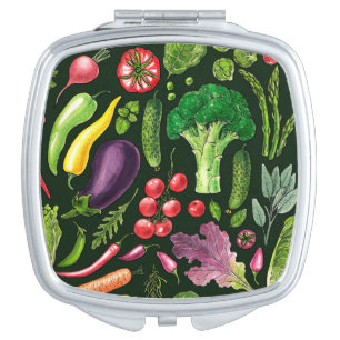 Vegetable and herbs garden harvest on black compact mirror