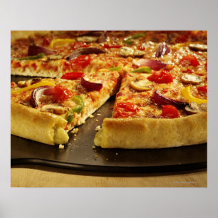 Vegetable pizza sliced on black pan on wood poster