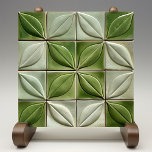 Verdant Illusion Faux Embossed Ceramic Tile<br><div class="desc">Invite the illusion of nature into your home with this verdantly designed ceramic tile, where the artistry of embossed leaves is cleverly captured in a flat, two-dimensional space. A spectrum of greens, from the lightest hint of lime to the deepest shade of forest, is rendered with such detail that each...</div>