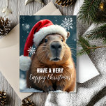 Very Cappy Christmas Capybara Christmas  Card<br><div class="desc">Send some Capy Christmas cheer this holiday season with this funny Christmas card featuring everyone’s favorite chill animal – the capybara! Decked out in a festive Santa hat and surrounded by snowflakes, this card brings an extra dose of humor to your holiday greetings. Perfect for adding a quirky touch to...</div>